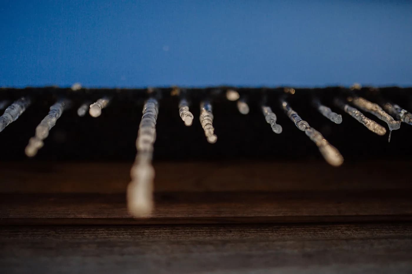 Hail-damaged roof shingles — the call surge that hits when storms roll through your market